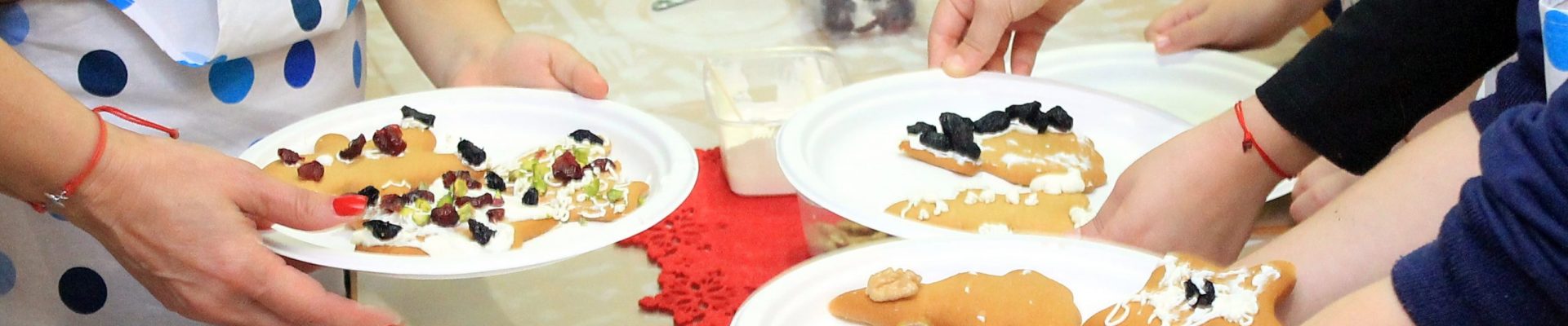 children prepare Christmas cookies
